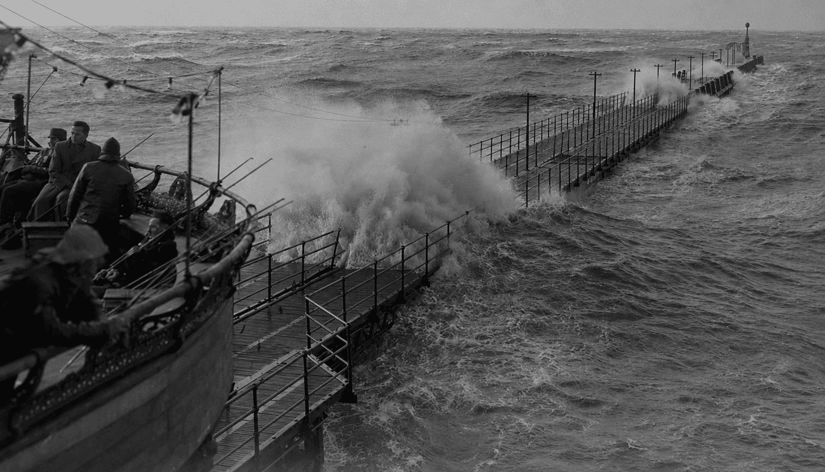 Heavy seas breaking over North Pier's former landing jetty
